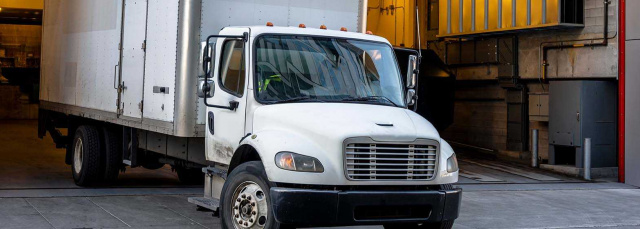 Transport business insurance - truck leaving warehouse